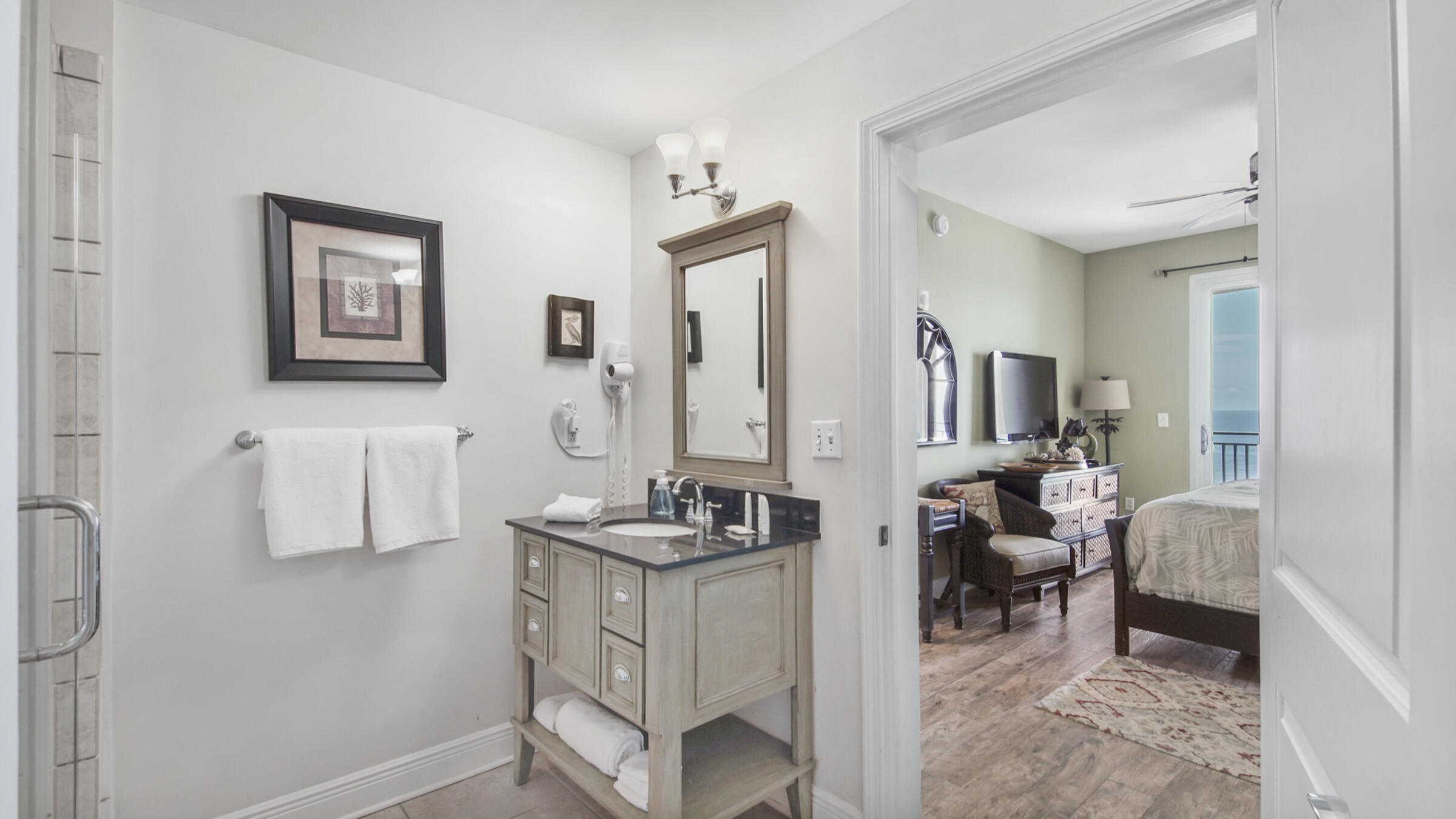 16701 Front Beach Road, Unit 1502 Panama City Beach, FL 32413 - Photo 15 of 33 a bathroom with a sink and a mirror