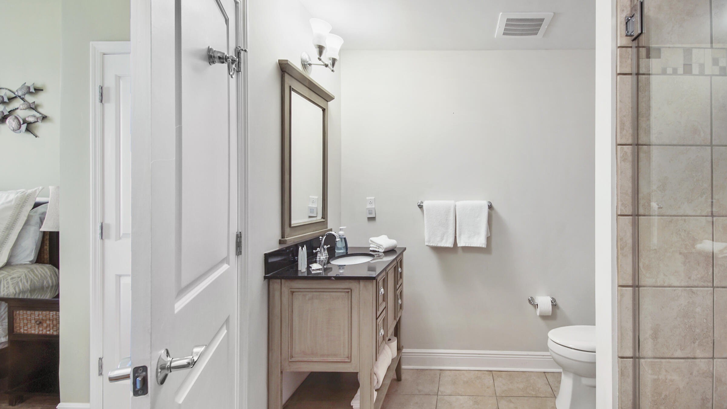16701 Front Beach Road, Unit 1502 Panama City Beach, FL 32413 - Photo 17 of 33 a bathroom with a sink and toilet