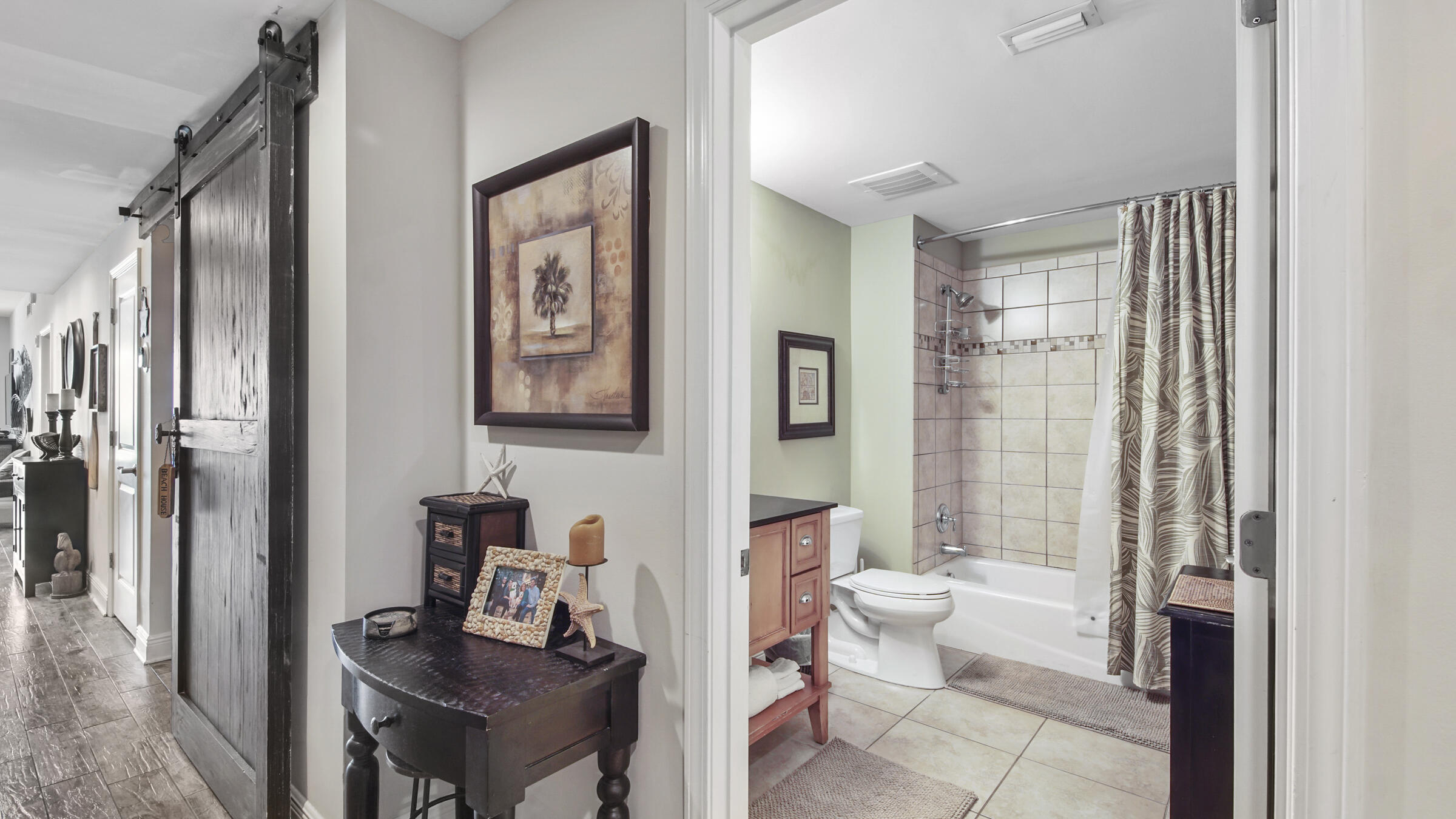 16701 Front Beach Road, Unit 1502 Panama City Beach, FL 32413 - Photo 22 of 33 a view of bathroom with a toilet a mirror and a shower
