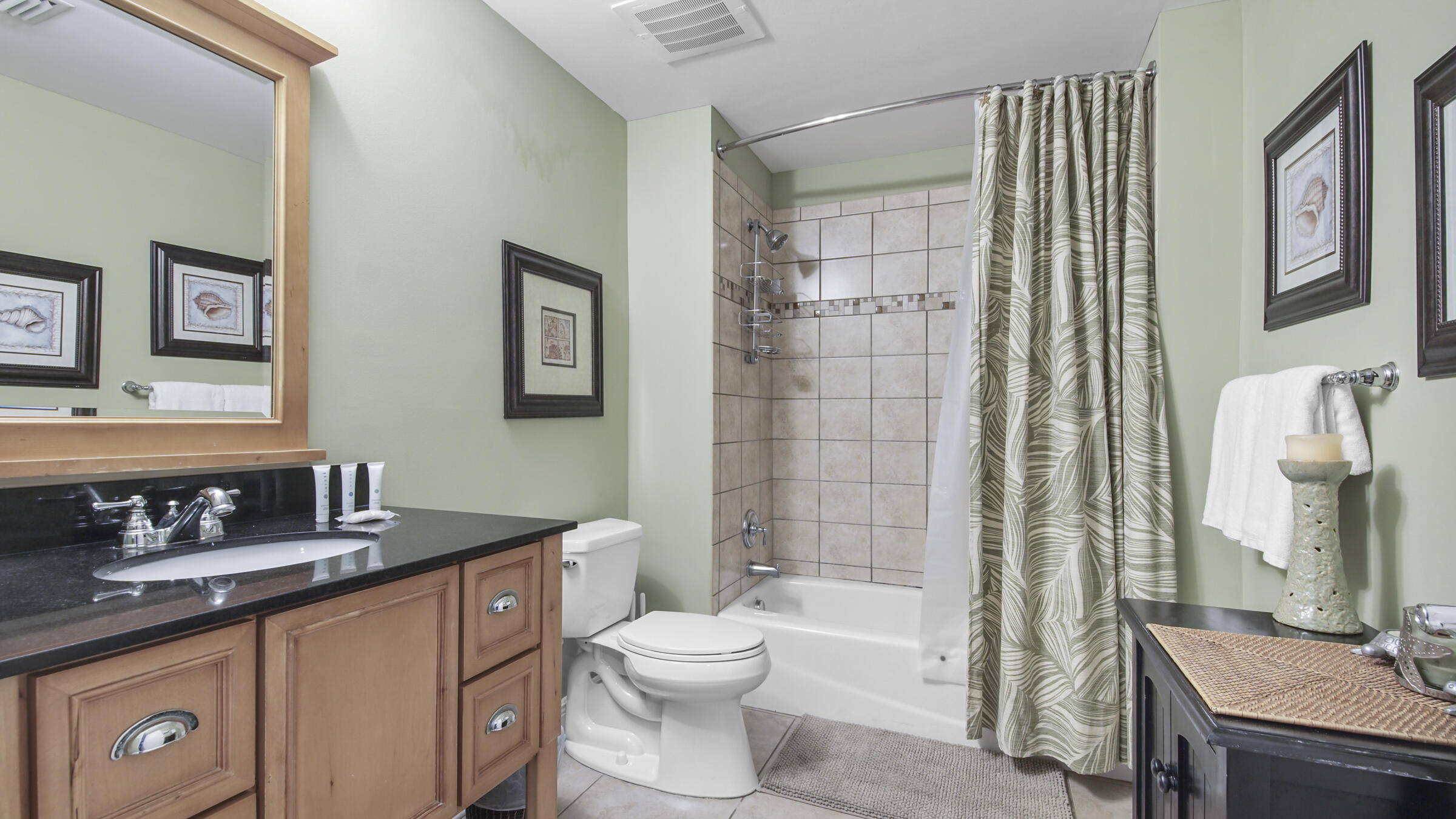 16701 Front Beach Road, Unit 1502 Panama City Beach, FL 32413 - Photo 23 of 33 a bathroom with a double vanity sink toilet and shower