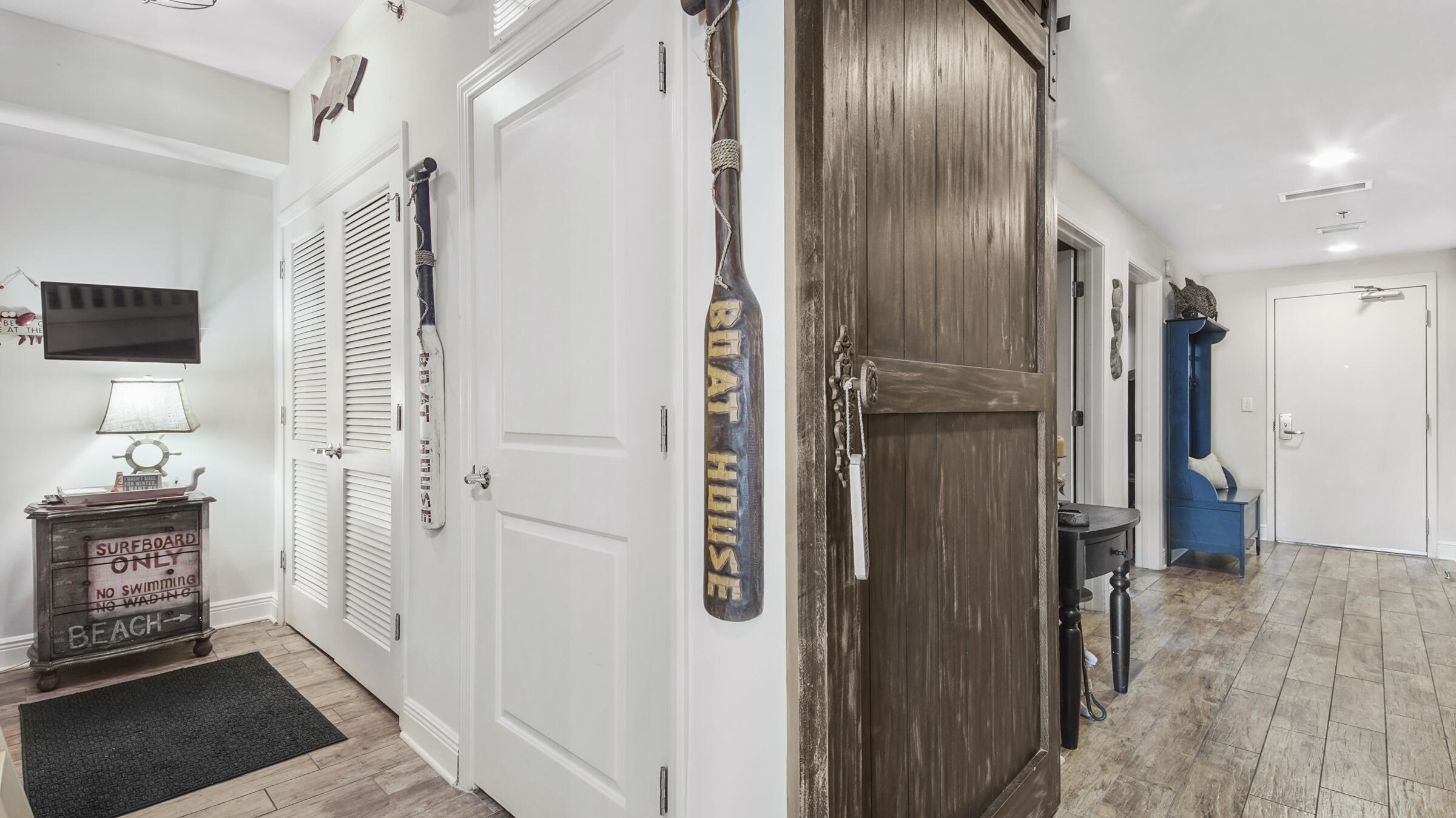 16701 Front Beach Road, Unit 1502 Panama City Beach, FL 32413 - Photo 24 of 33 a view of a hallway with wooden floor and staircase