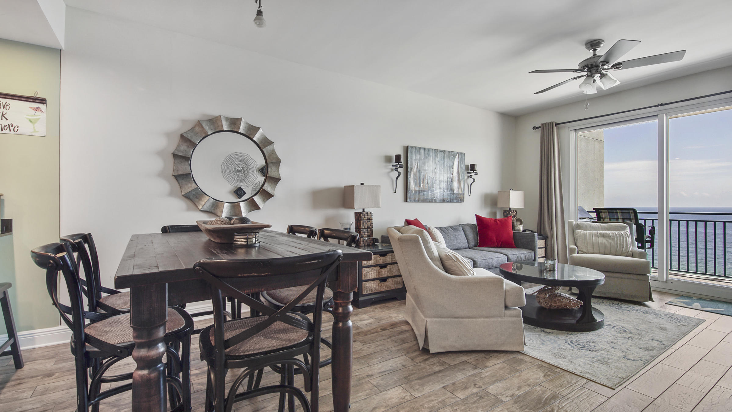 16701 Front Beach Road, Unit 1502 Panama City Beach, FL 32413 - Photo 27 of 33 a living room with furniture a rug and a large window