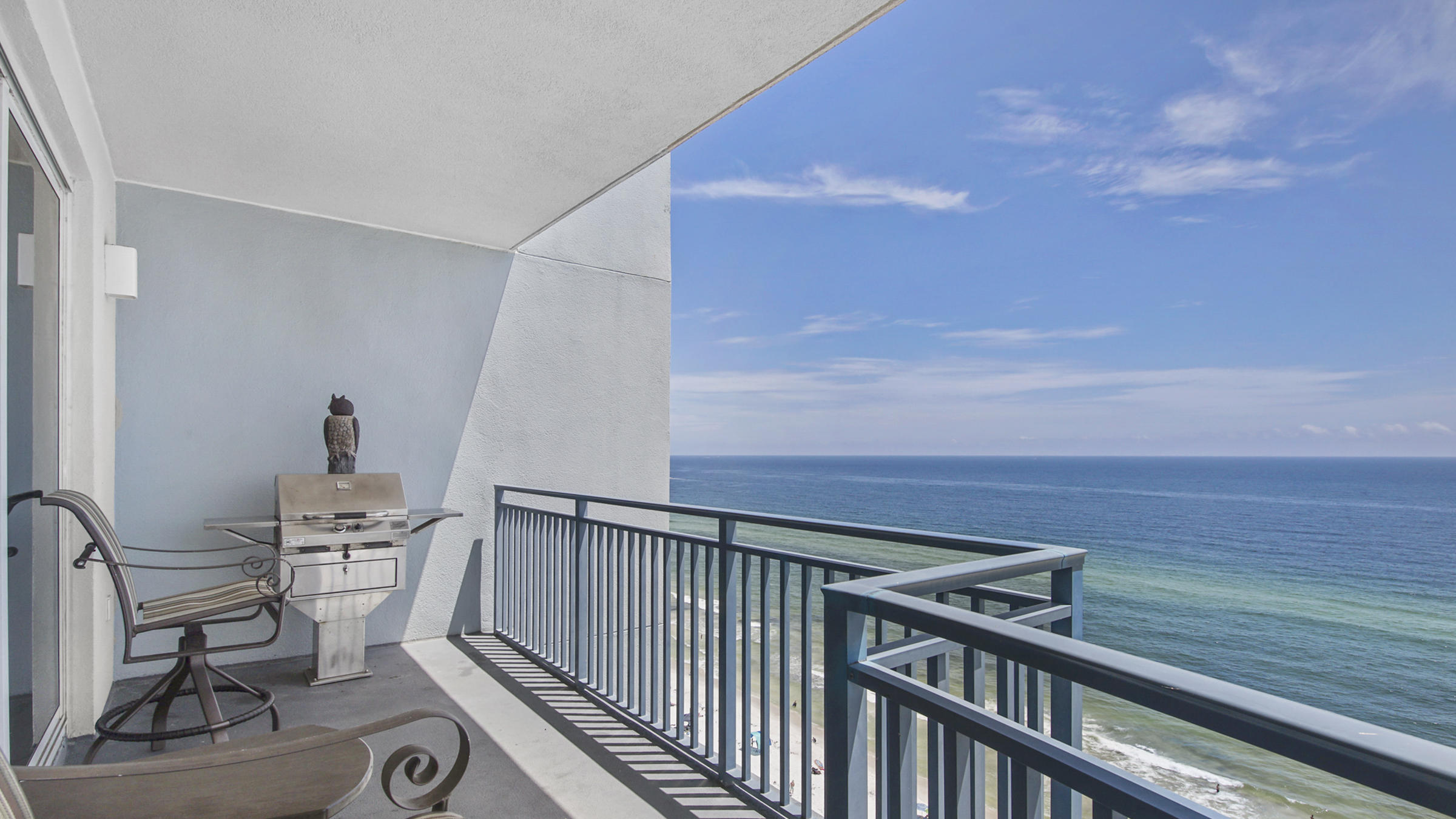 16701 Front Beach Road, Unit 1502 Panama City Beach, FL 32413 - Photo 5 of 33 a view of a chairs and table in the balcony