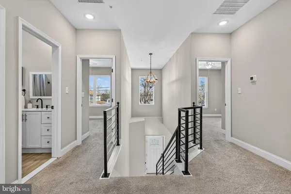 a view of a hallway with seating area