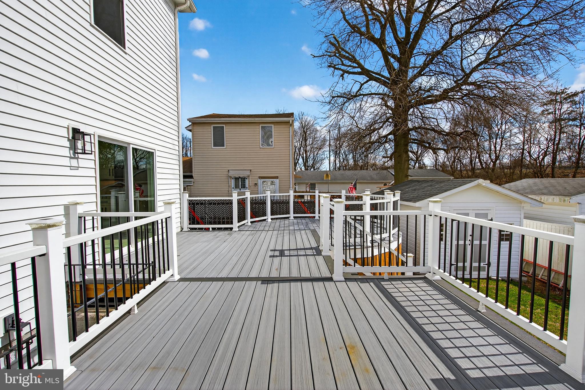 511 Patuxent Avenue Rosedale, MD 21237 - Photo 34 of 51 a view of a balcony with wooden floor and fence