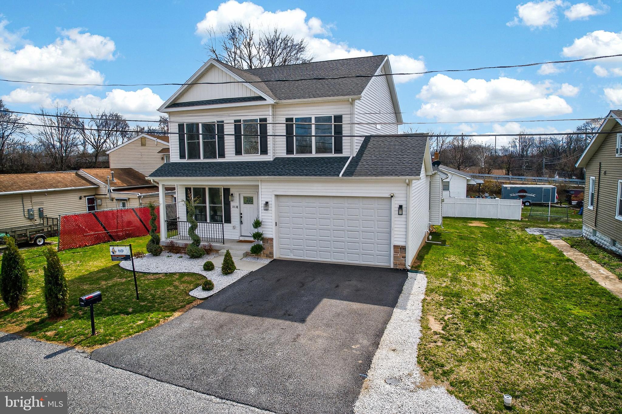 511 Patuxent Avenue Rosedale, MD 21237 - Photo 6 of 51 a front view of house with yard