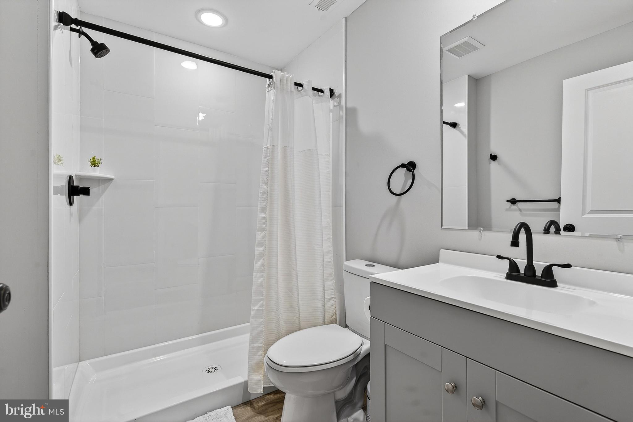 511 Patuxent Avenue Rosedale, MD 21237 - Photo 8 of 51 a bathroom with a sink toilet and shower