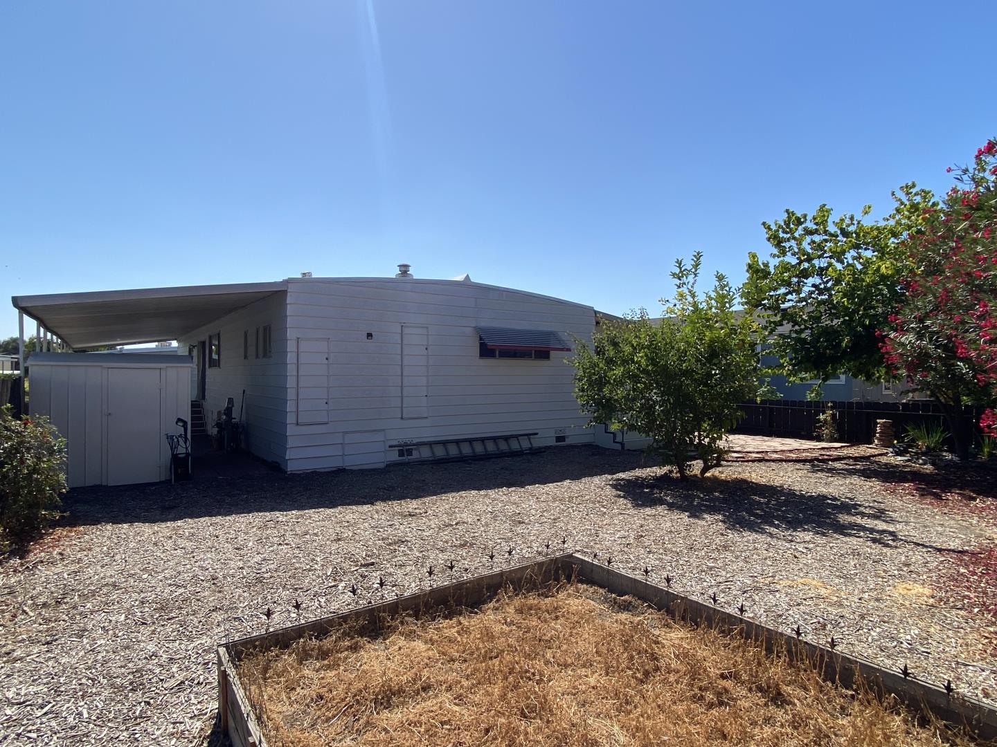 1220 Tasman Drive, Unit 159 Sunnyvale, CA 94089 - Photo 11 of 46 a backyard of a house with yard and outdoor seating