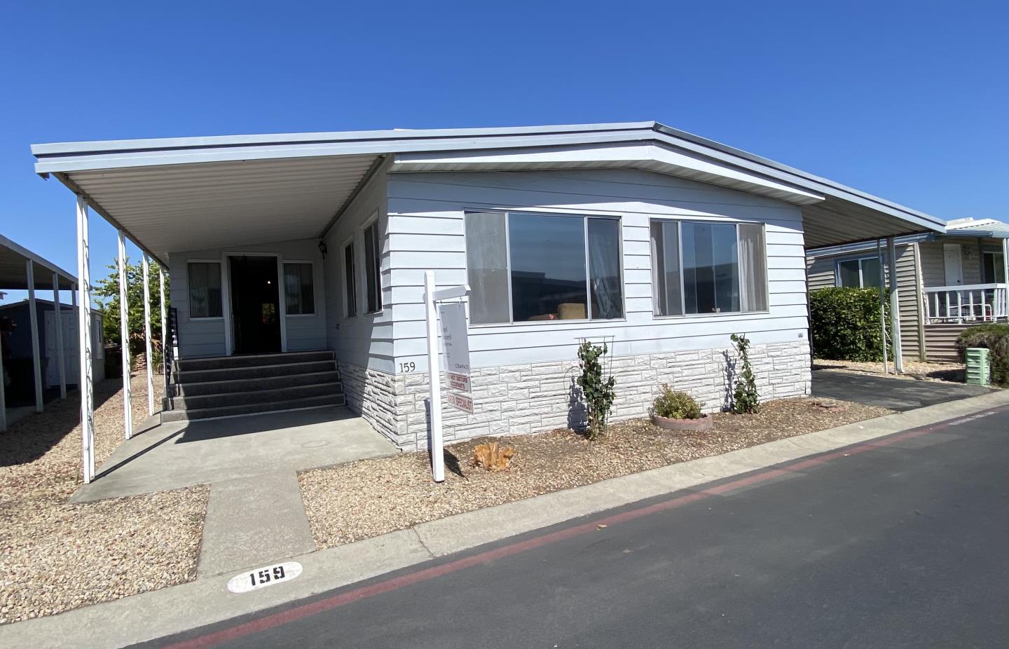 1220 Tasman Drive, Unit 159 Sunnyvale, CA 94089 - Photo 12 of 46 a front view of a house with garage