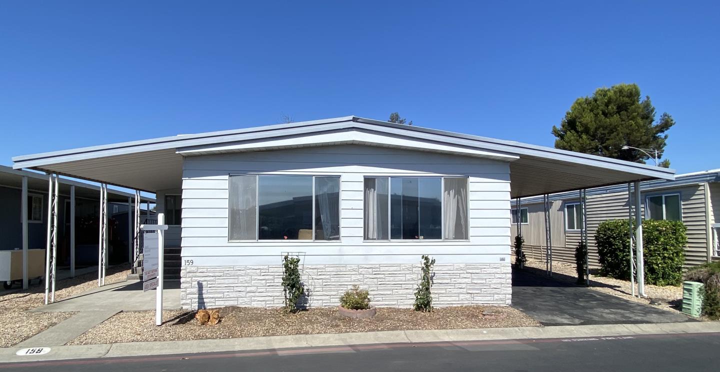 1220 Tasman Drive, Unit 159 Sunnyvale, CA 94089 - Photo 15 of 46 a front view of a house with a garage
