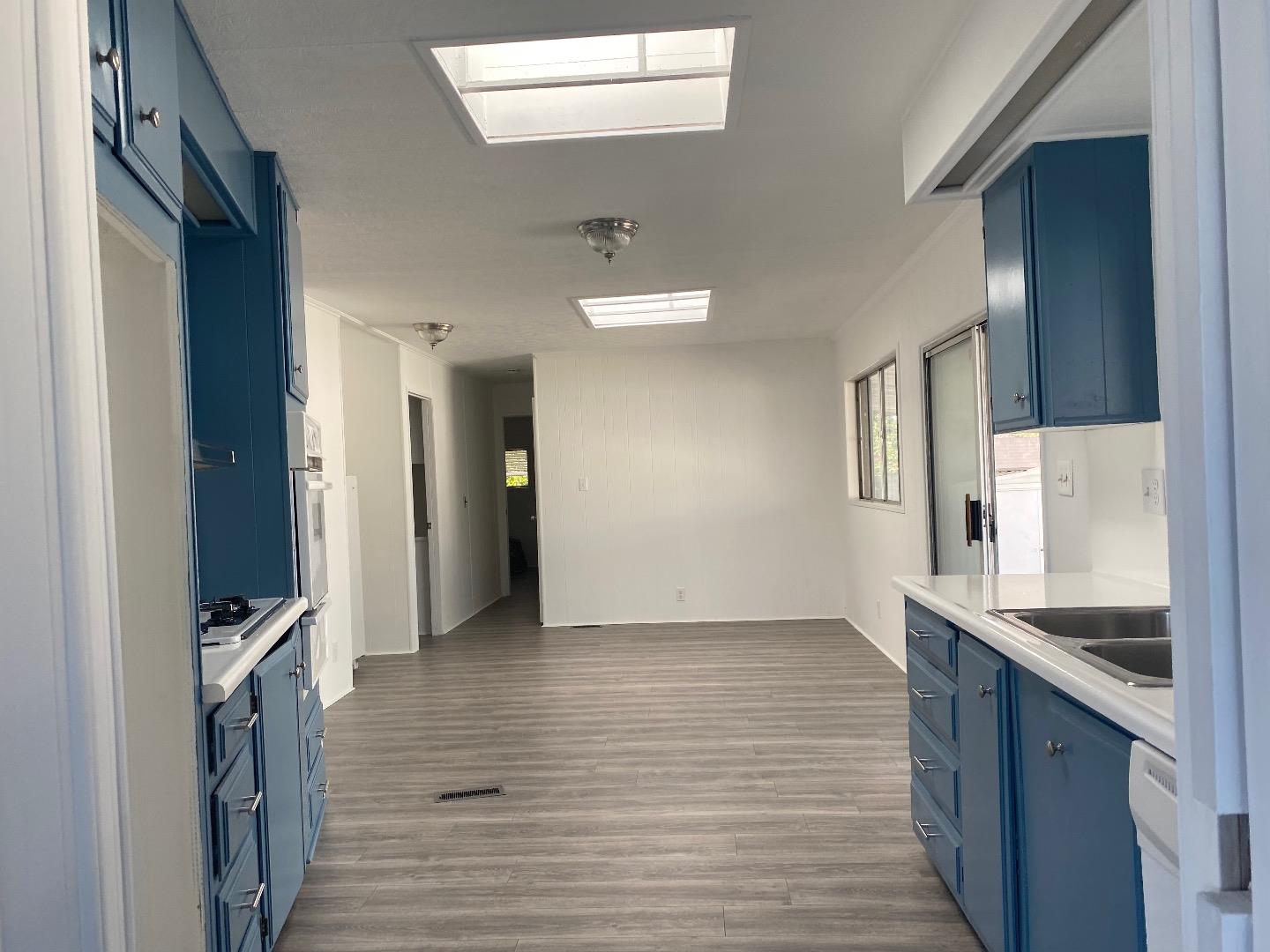 1220 Tasman Drive, Unit 159 Sunnyvale, CA 94089 - Photo 3 of 46 a view of a kitchen cabinets a sink and dishwasher in a kitchen