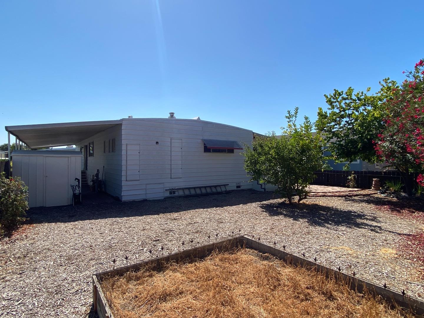 1220 Tasman Drive, Unit 159 Sunnyvale, CA 94089 - Photo 21 of 46 a backyard of a house with yard and outdoor seating