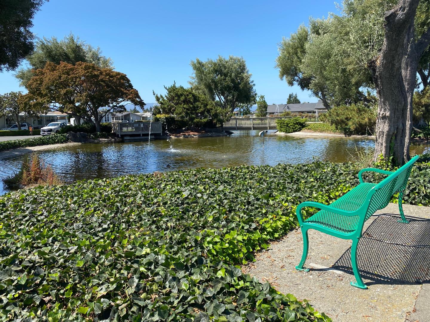 1220 Tasman Drive, Unit 159 Sunnyvale, CA 94089 - Photo 40 of 46 a view of a lake with a bench next to a lake