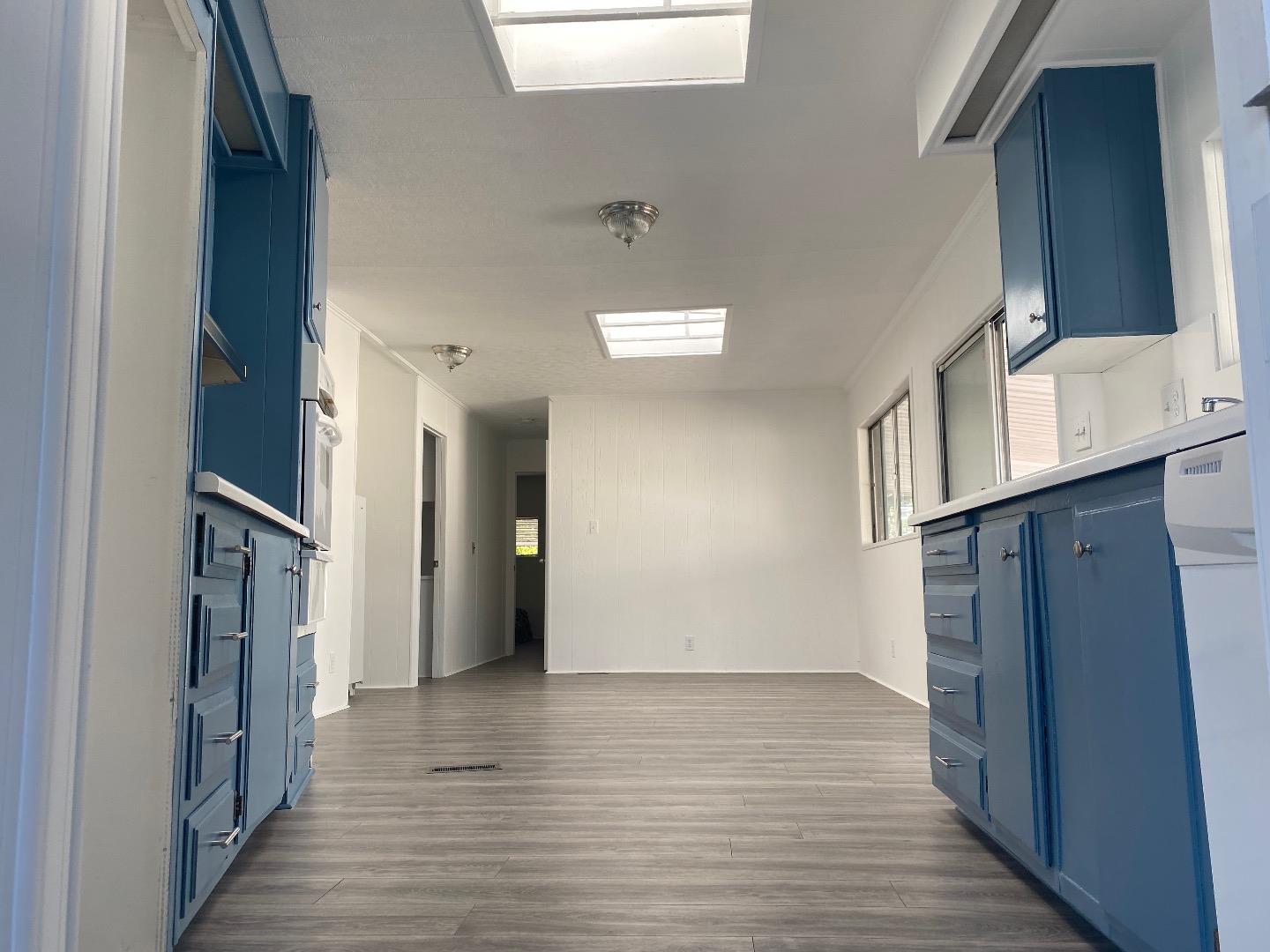 1220 Tasman Drive, Unit 159 Sunnyvale, CA 94089 - Photo 6 of 46 a view of a hallway with wooden floor and staircase