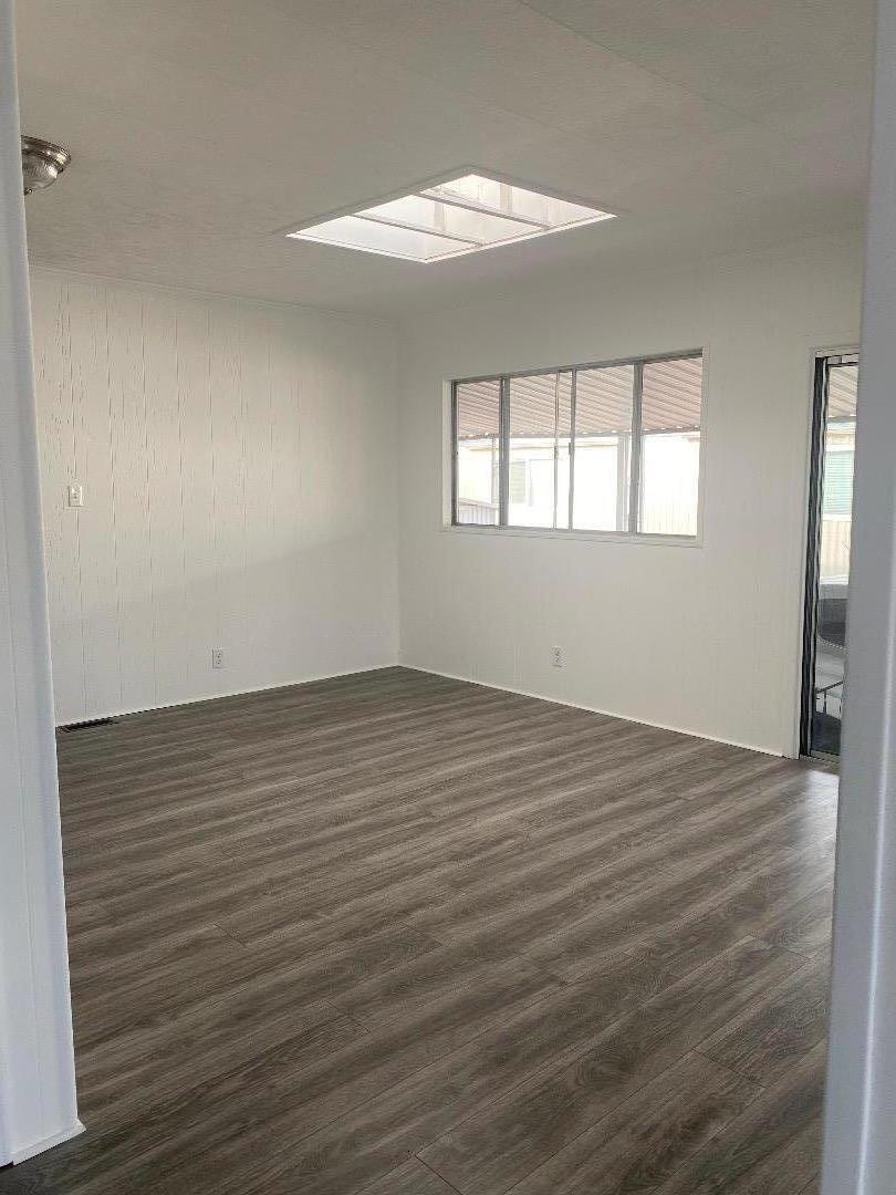 1220 Tasman Drive, Unit 159 Sunnyvale, CA 94089 - Photo 7 of 46 wooden floor in an empty room with a window