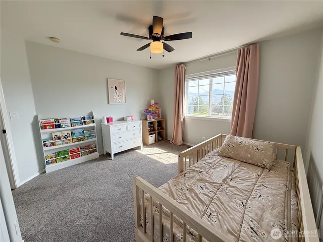 a living room with furniture and windows