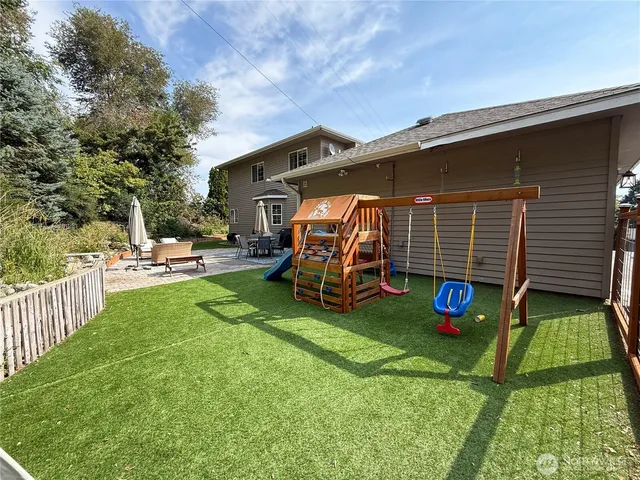 a view of a backyard with a patio