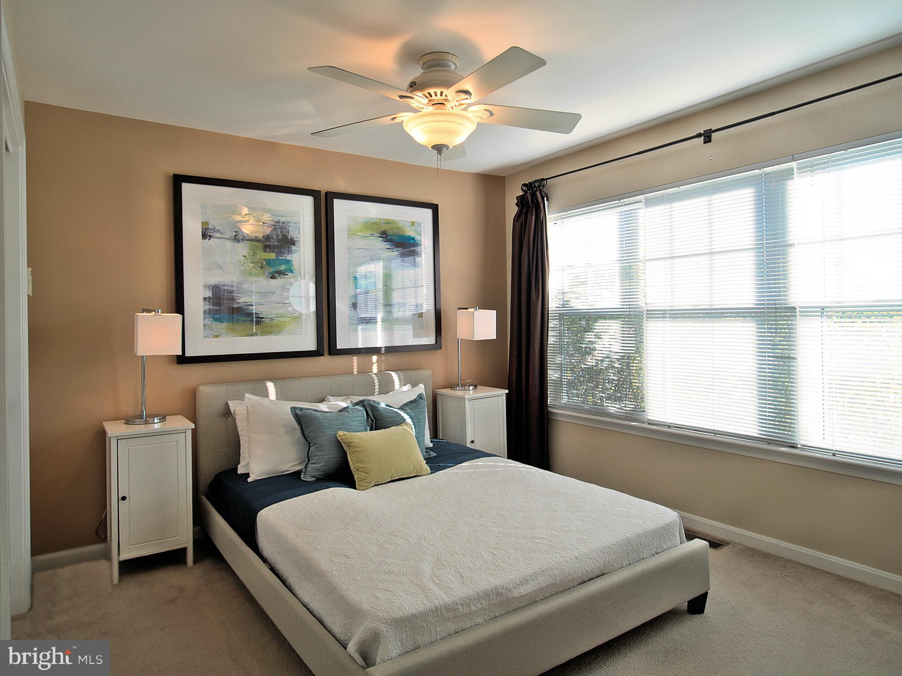 6827 4th Street Northwest, Unit 304 Washington, DC 20012 - Photo 12 of 23 a bedroom with a large bed and a window