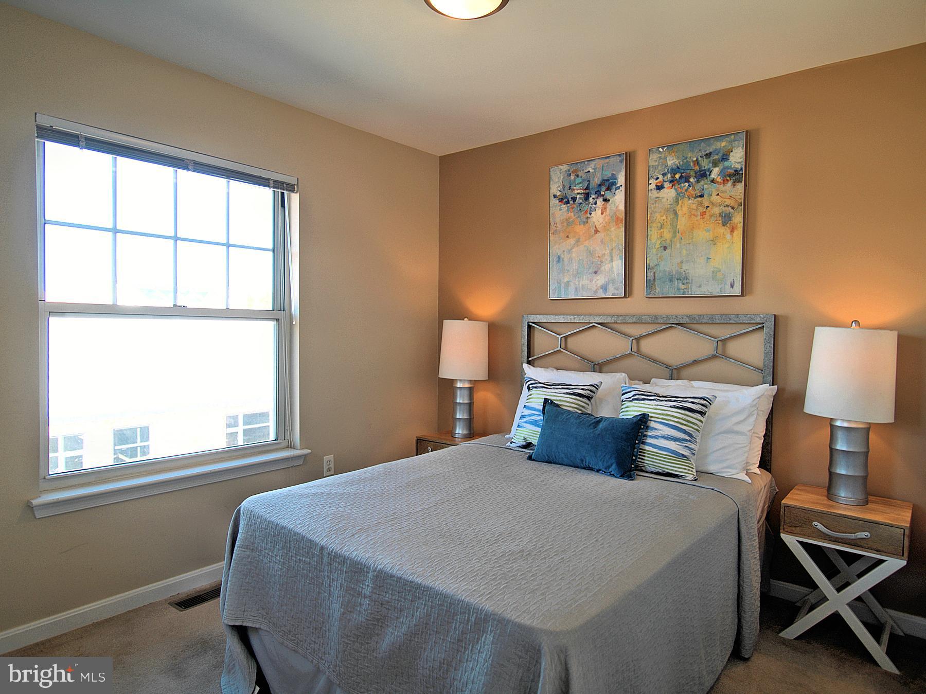 6827 4th Street Northwest, Unit 304 Washington, DC 20012 - Photo 15 of 23 a bedroom with a bed and window