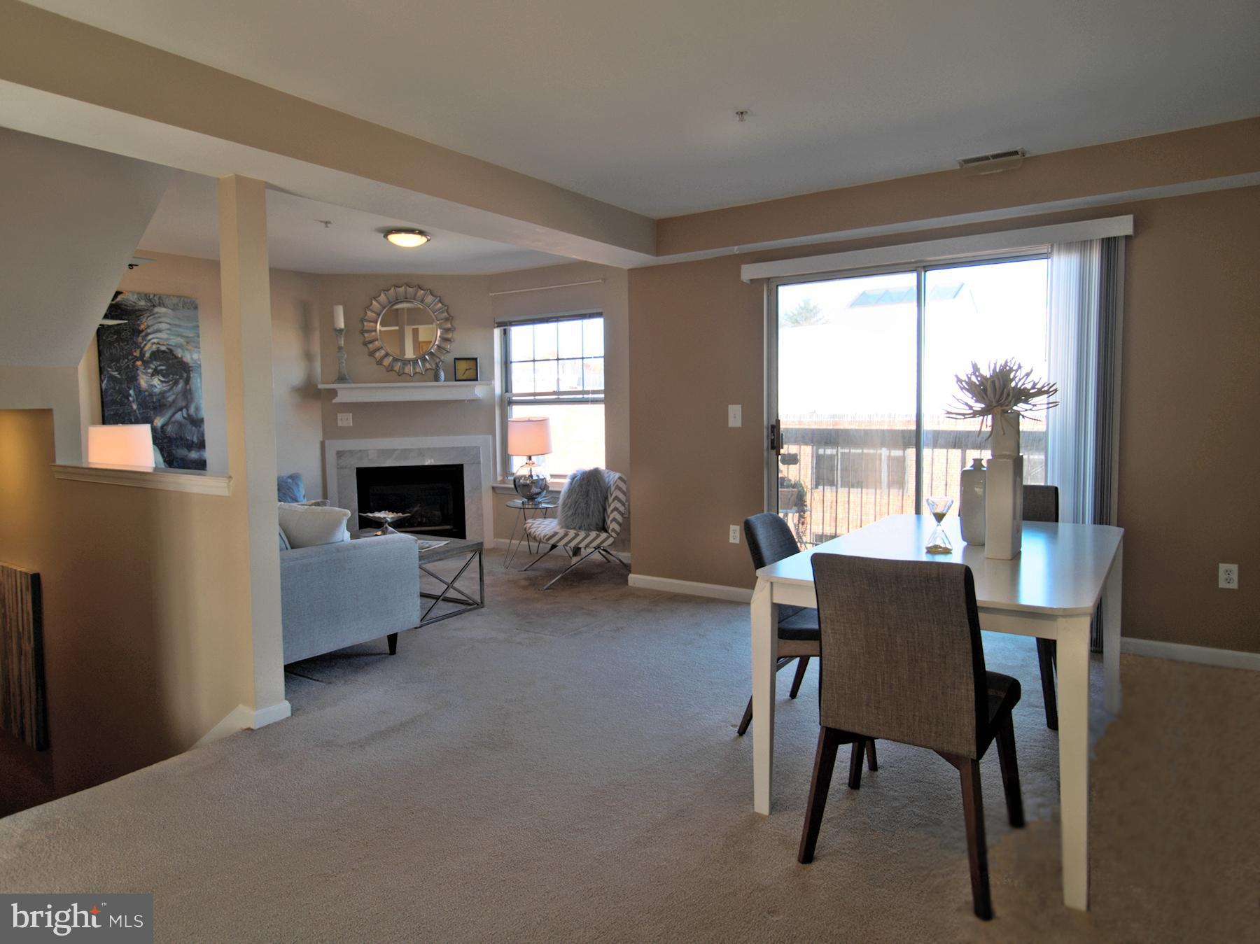 6827 4th Street Northwest, Unit 304 Washington, DC 20012 - Photo 4 of 23 a living room with furniture and a fireplace