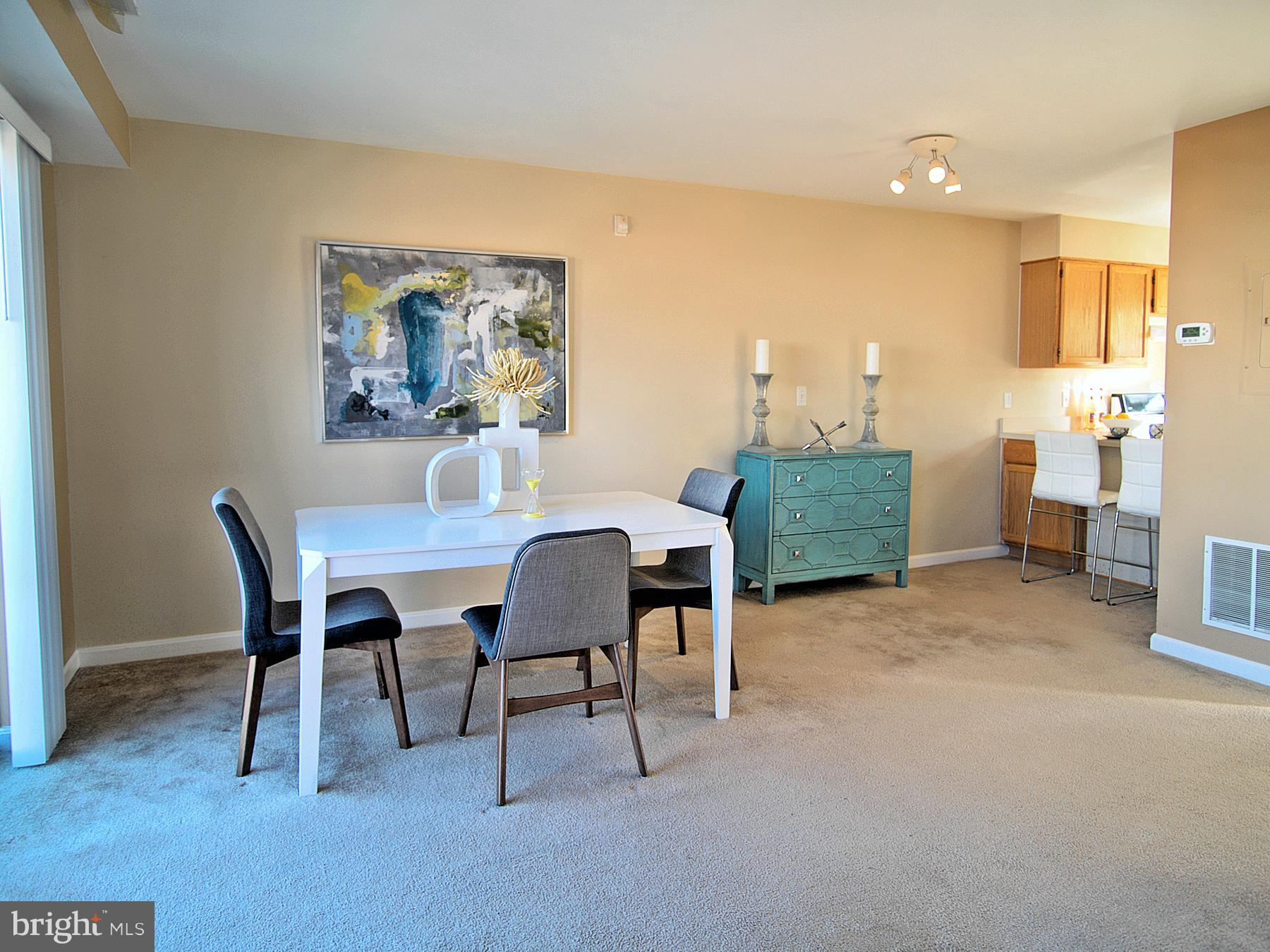 6827 4th Street Northwest, Unit 304 Washington, DC 20012 - Photo 6 of 23 a view of a dining room with furniture and a chandelier
