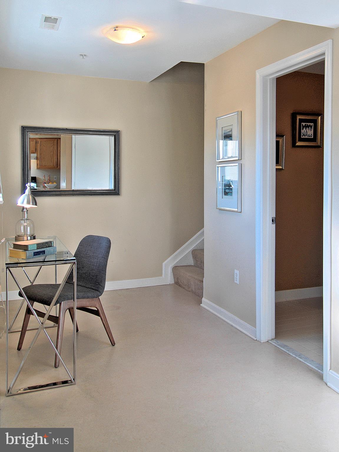 6827 4th Street Northwest, Unit 304 Washington, DC 20012 - Photo 10 of 23 a work room with furniture and wooden floor