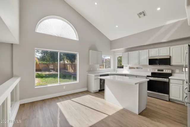 a view of living room with furniture and window