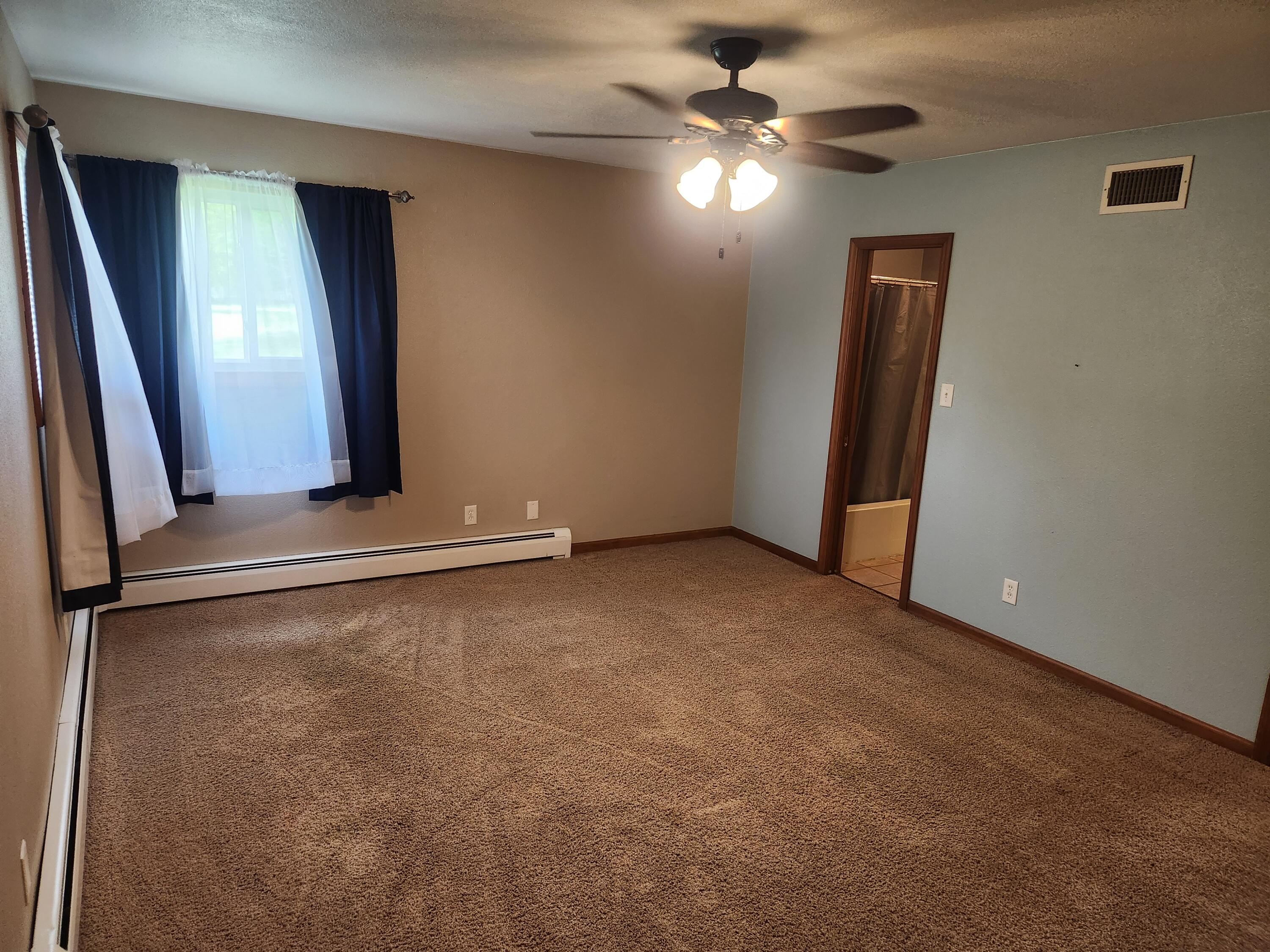 4726 Locksley Drive East Rensselaer, IN 47978 - Photo 27 of 33 an empty room with windows and fan