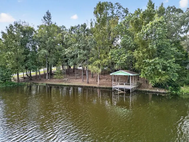 a view of a large body of water with water fall and outdoor seating