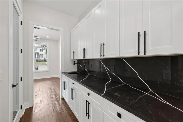 a view of a living room with furniture and a potted plant
