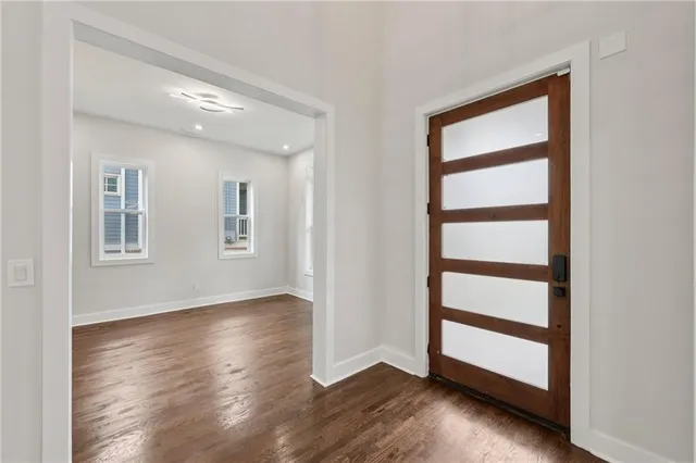 a view of front door with wooden floor