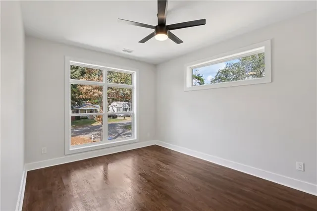 a bathroom with a toilet a sink and shower