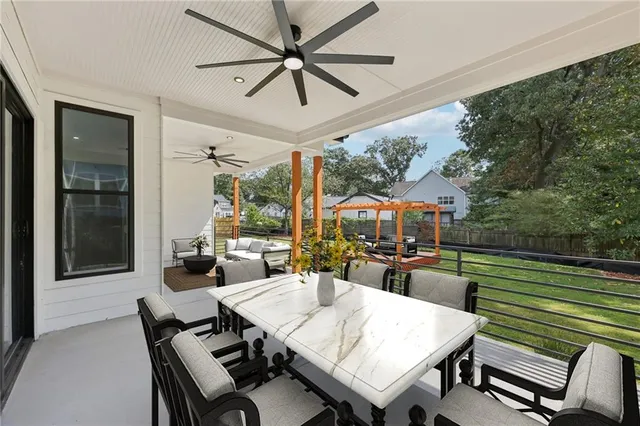 a outdoor living space with patio furniture and a potted plant