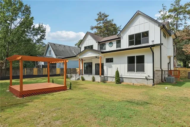 a aerial view of a house with swimming pool