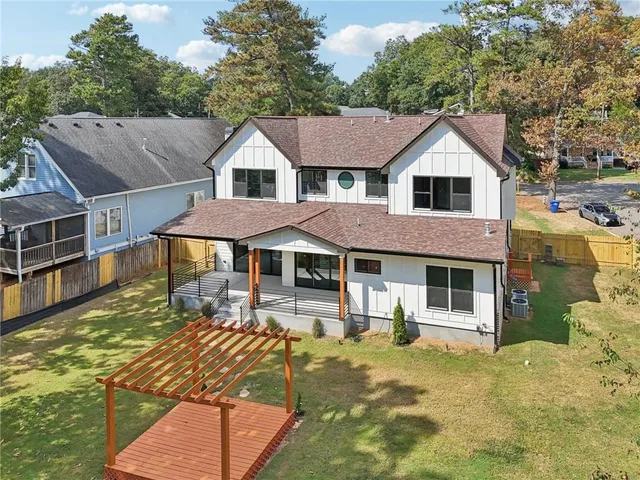an aerial view of a house with outdoor space