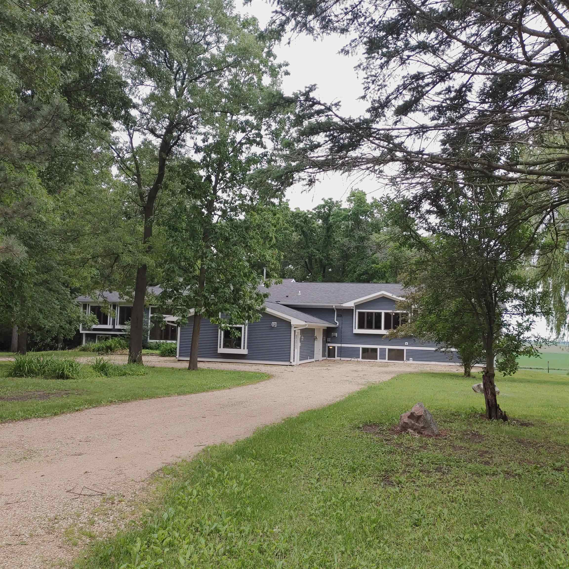 10799 Randall Road Capron, IL 61012 - Photo 1 of 68 a house view with swimming pool and trees