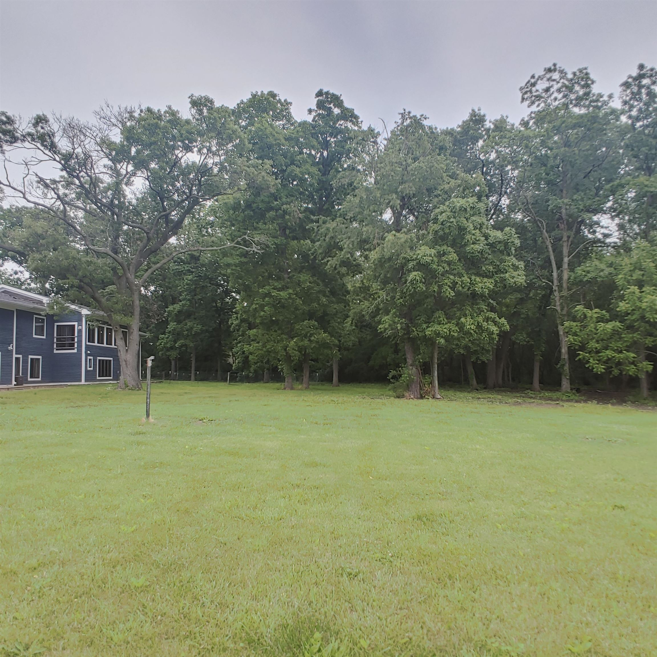 10799 Randall Road Capron, IL 61012 - Photo 14 of 68 a view of a yard with a tree
