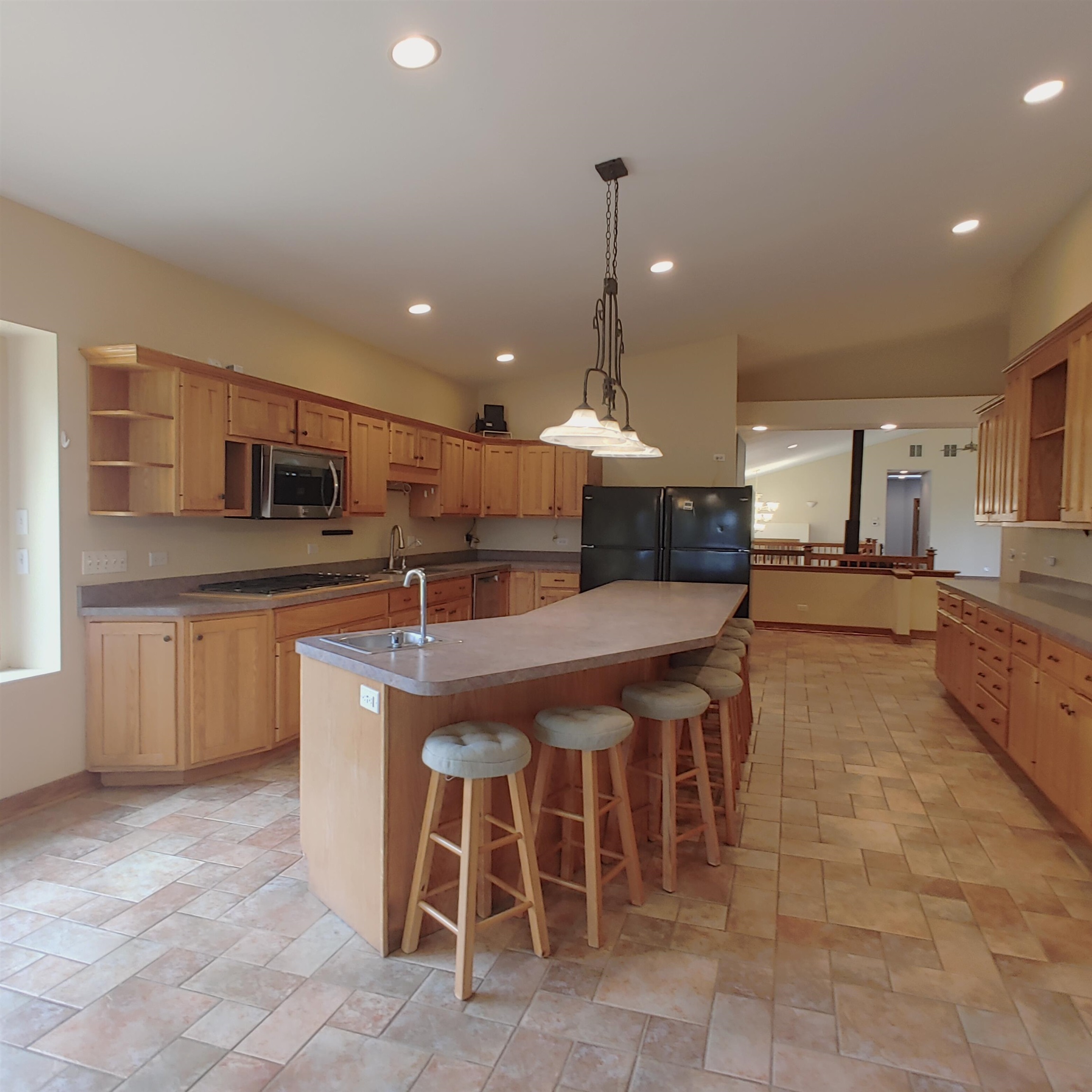 10799 Randall Road Capron, IL 61012 - Photo 31 of 68 a large kitchen with a table and chairs