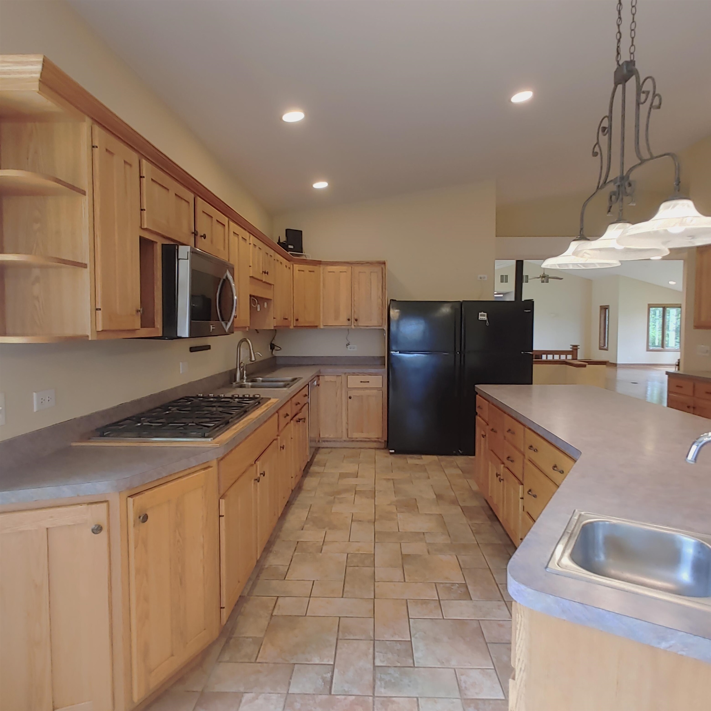 10799 Randall Road Capron, IL 61012 - Photo 34 of 68 a large kitchen with stainless steel appliances granite countertop a sink and a refrigerator