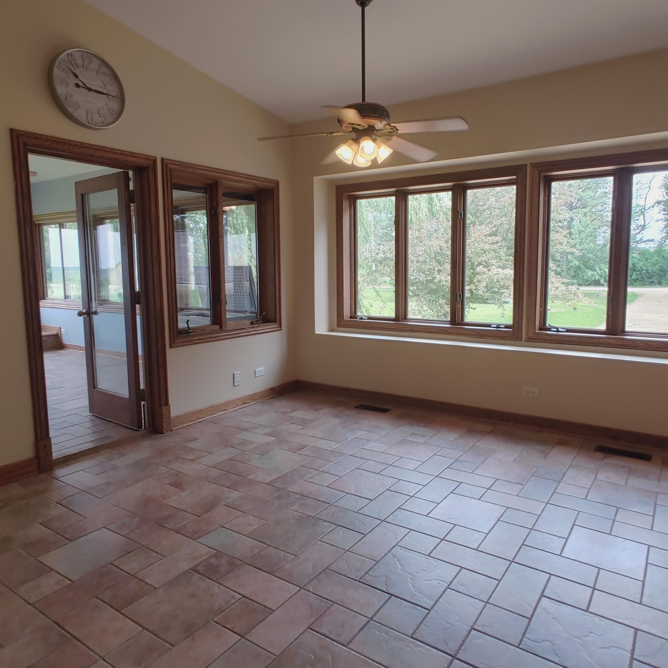 10799 Randall Road Capron, IL 61012 - Photo 36 of 68 a view of an empty room with a window and chandelier fan