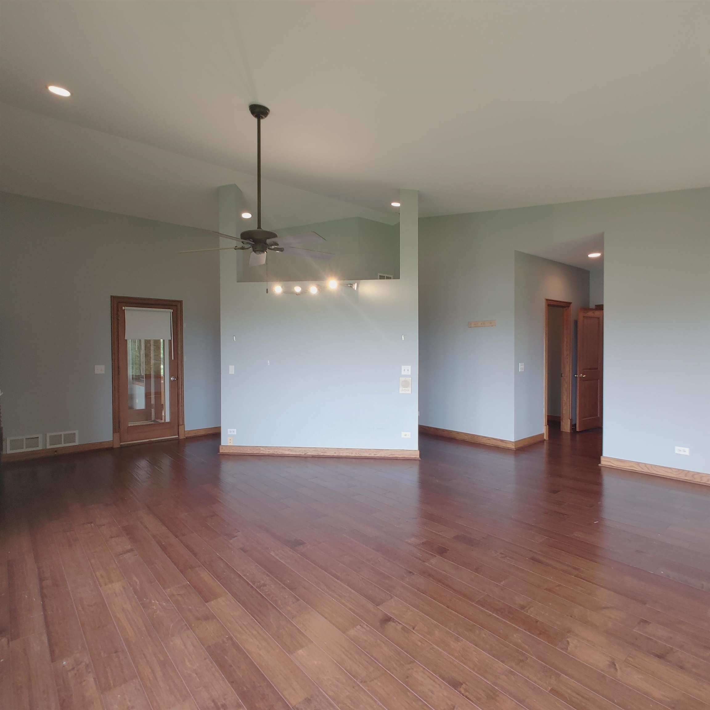 10799 Randall Road Capron, IL 61012 - Photo 40 of 68 a view of an empty room with wooden floor and a window