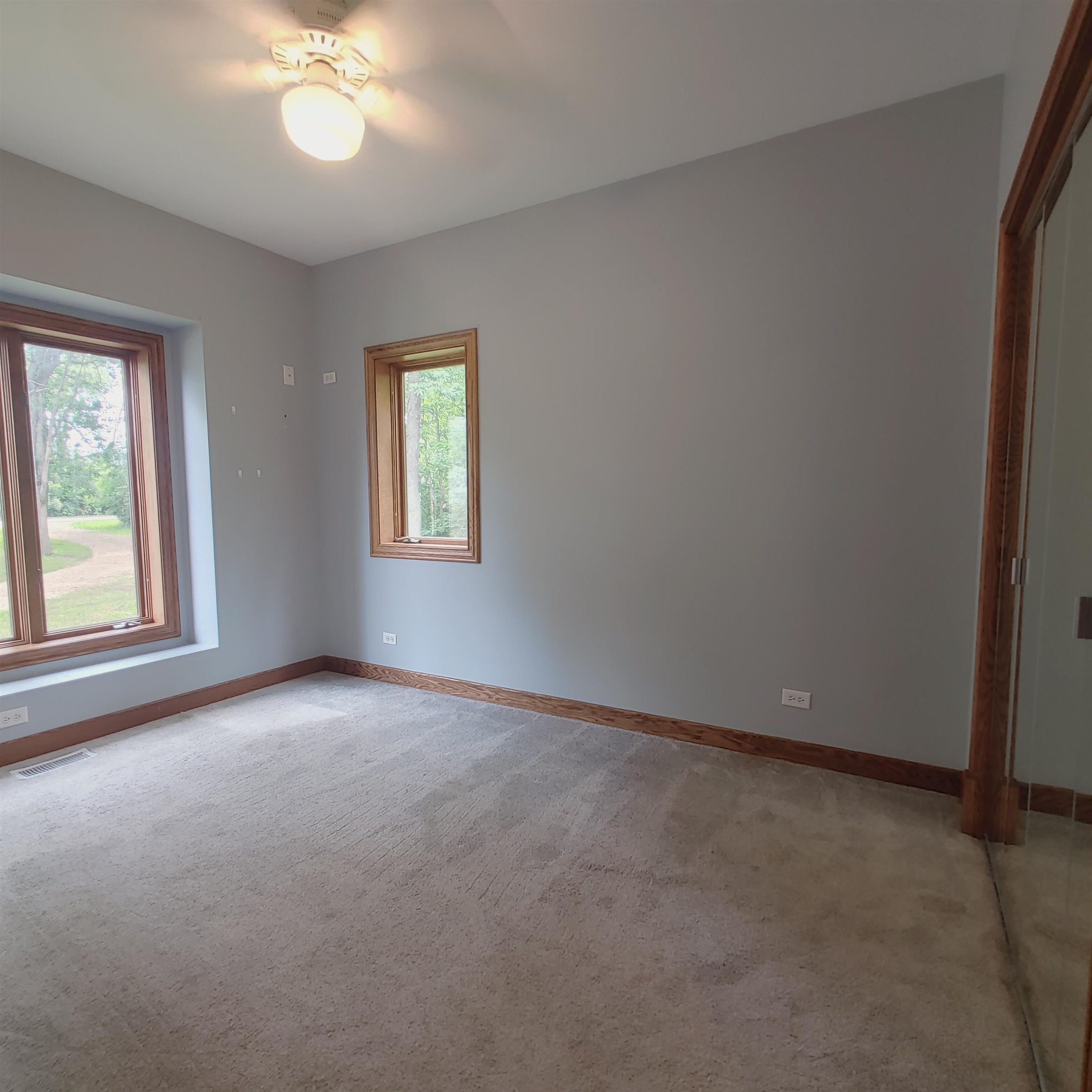 10799 Randall Road Capron, IL 61012 - Photo 47 of 68 an empty room with windows and fan