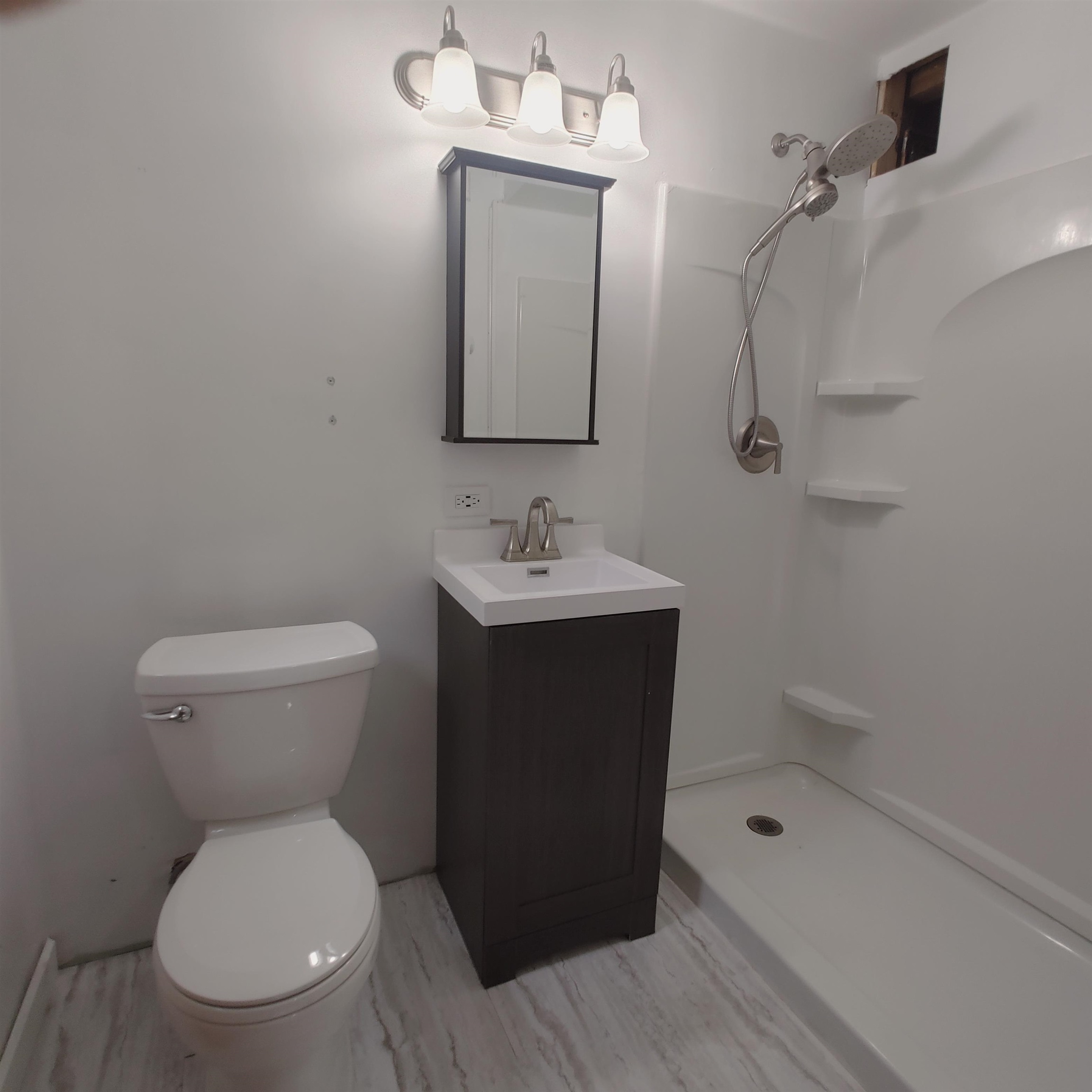 10799 Randall Road Capron, IL 61012 - Photo 59 of 68 a bathroom with a sink a toilet and shower