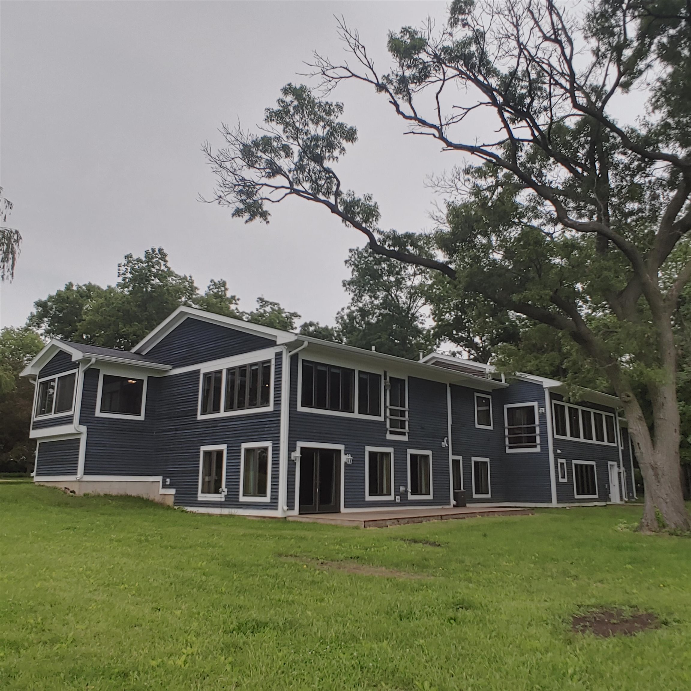 10799 Randall Road Capron, IL 61012 - Photo 6 of 68 a front view of a house with a garden