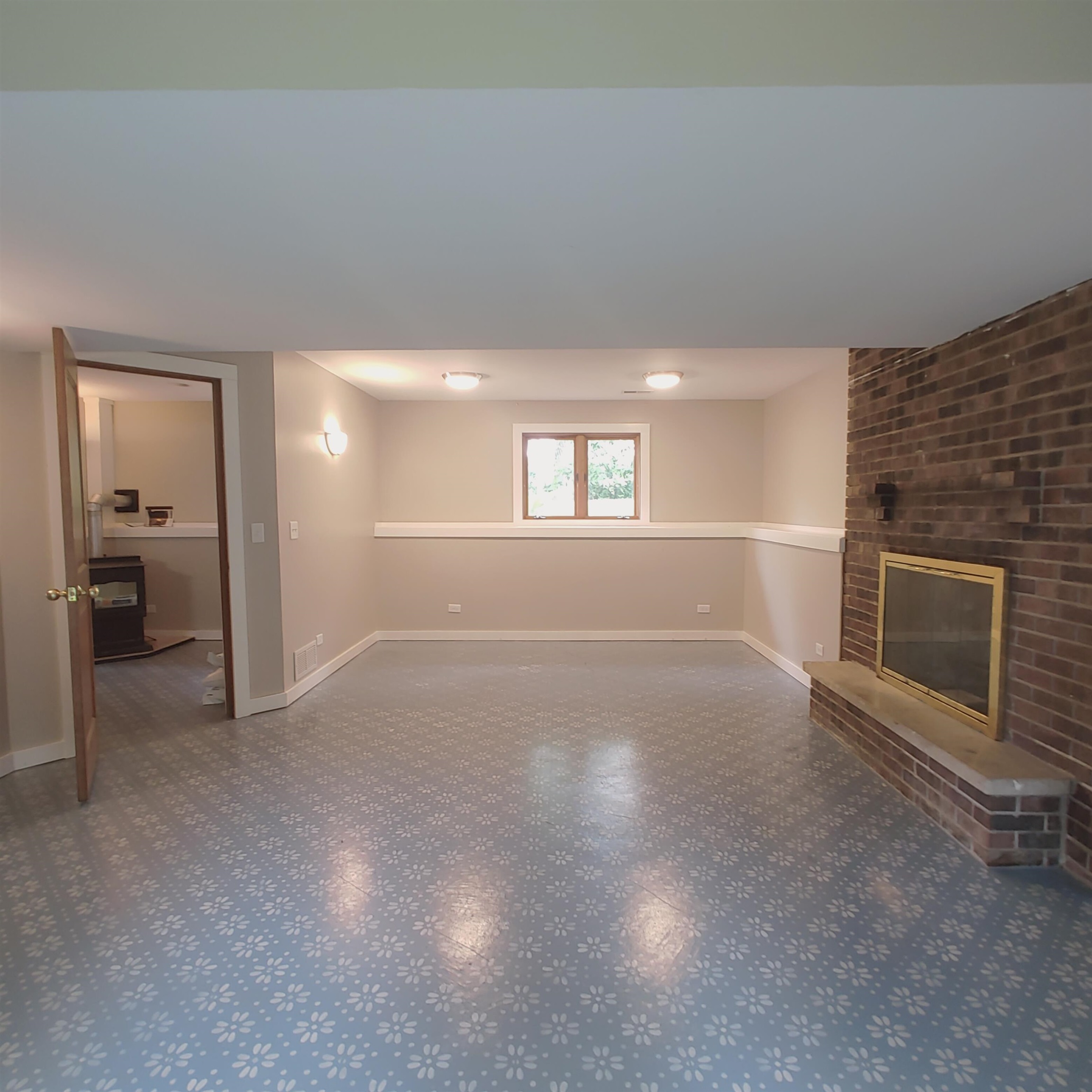 10799 Randall Road Capron, IL 61012 - Photo 67 of 68 an empty room with windows and fireplace