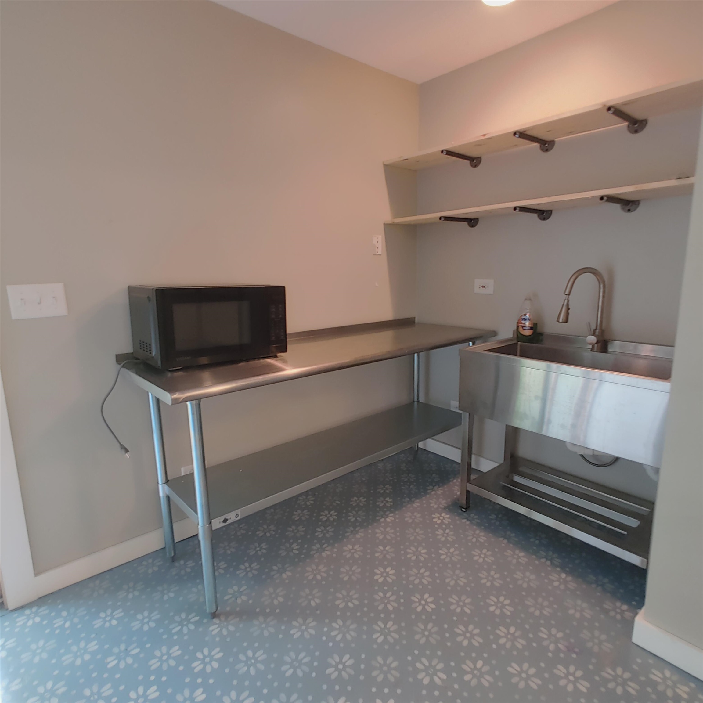 10799 Randall Road Capron, IL 61012 - Photo 68 of 68 a kitchen with white cabinets and black appliances