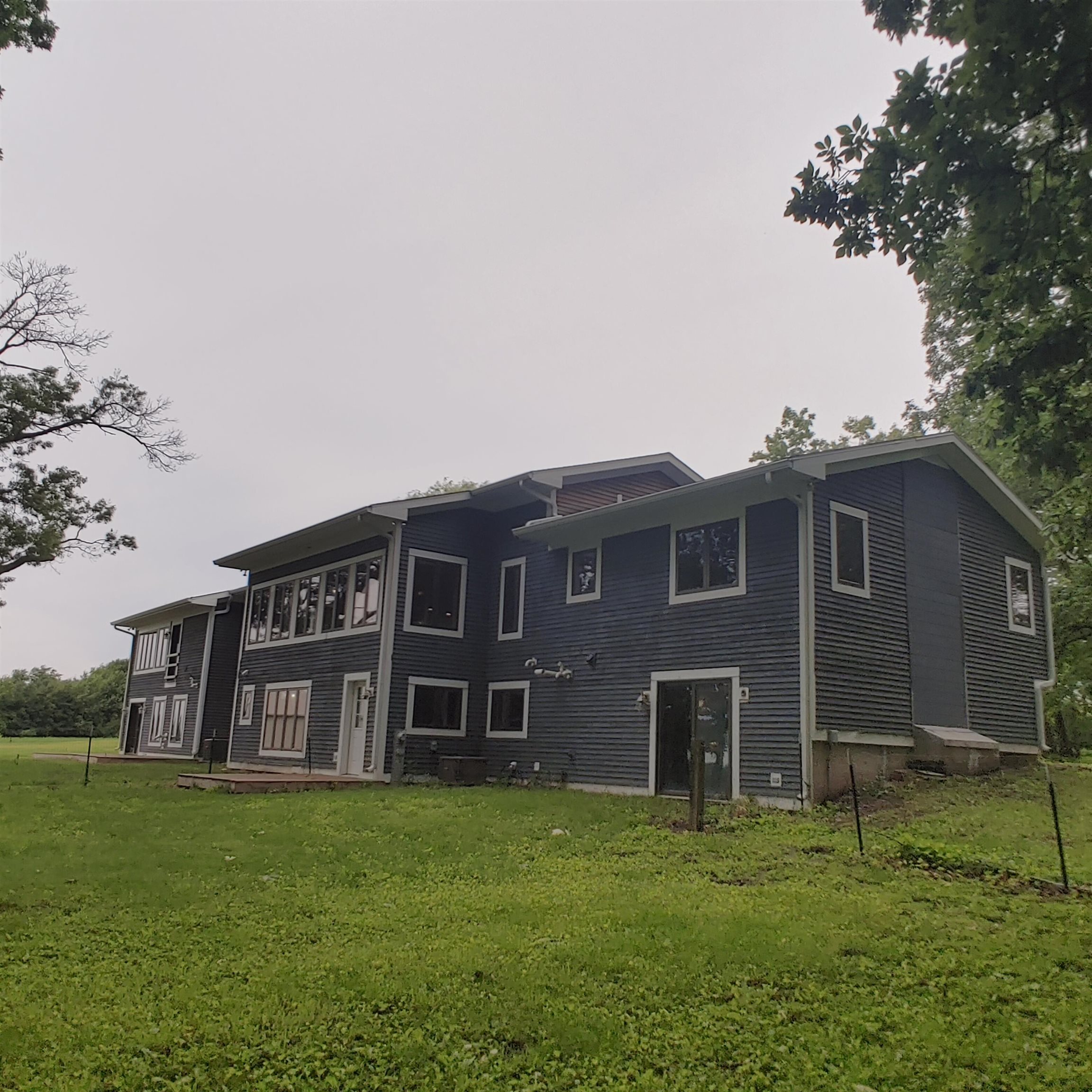 10799 Randall Road Capron, IL 61012 - Photo 8 of 68 a view of a house with a yard