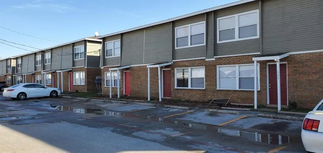 a front view of a house with yard
