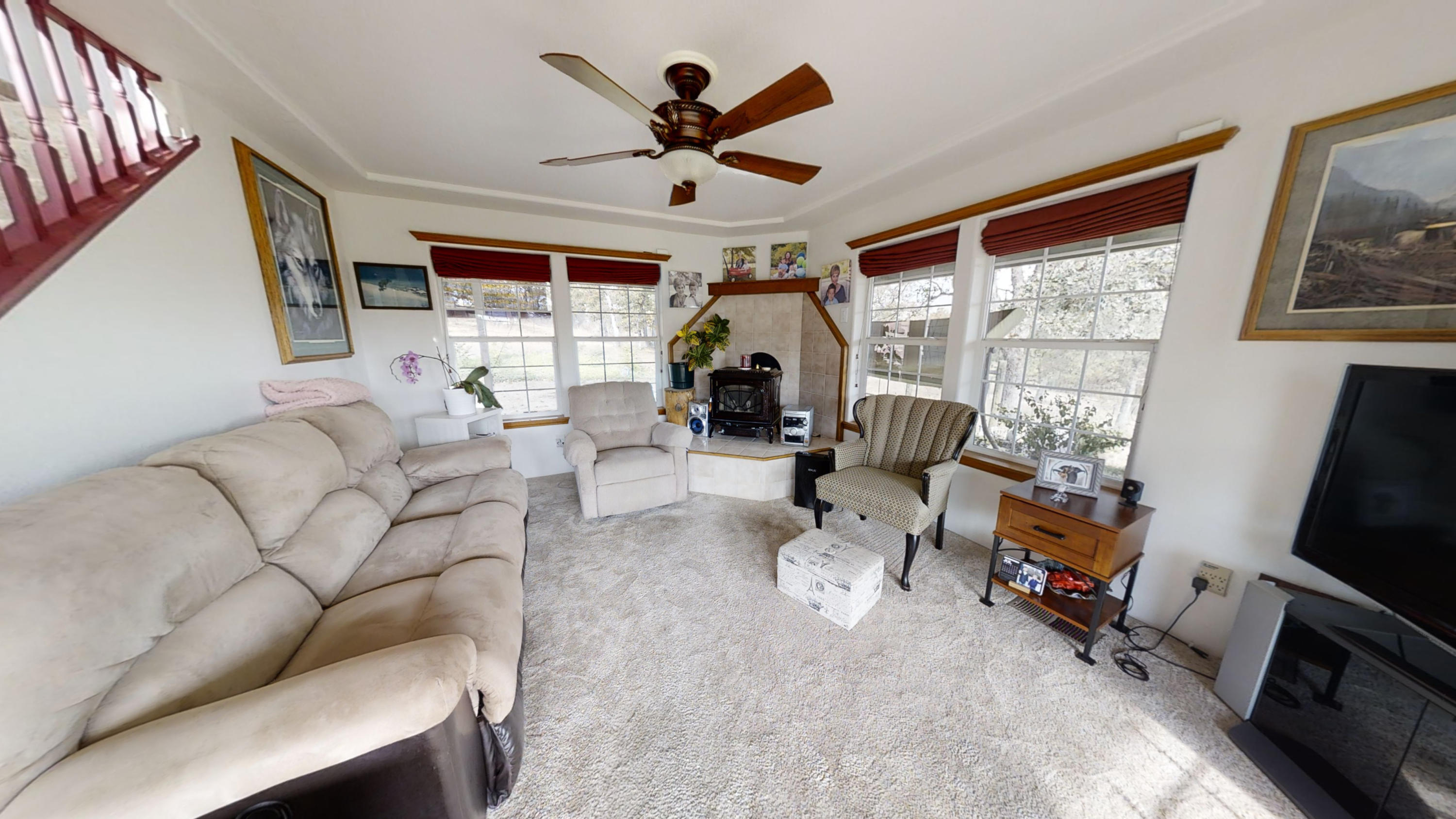 1023 Bigham Brown Road Eagle Point, OR 97524 - Photo 8 of 52 a living room with furniture a fireplace and a large window