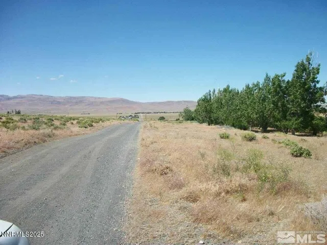 a view of a road with an ocean view